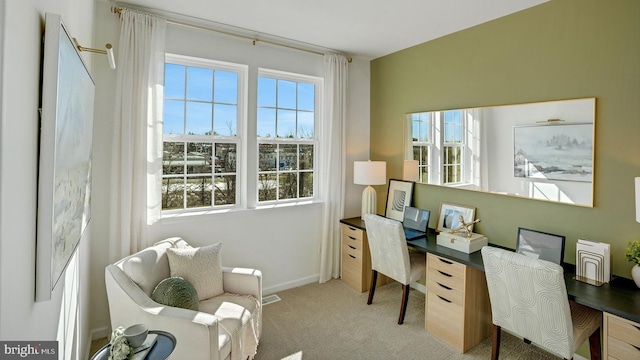 carpeted home office featuring baseboards