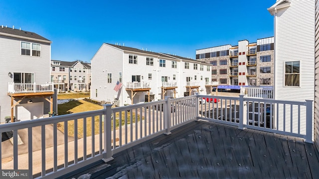 wooden terrace with a residential view
