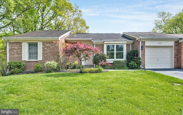 ranch-style house with brick siding, a garage, driveway, and a front yard
