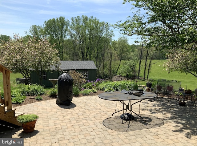 view of patio with an outdoor structure