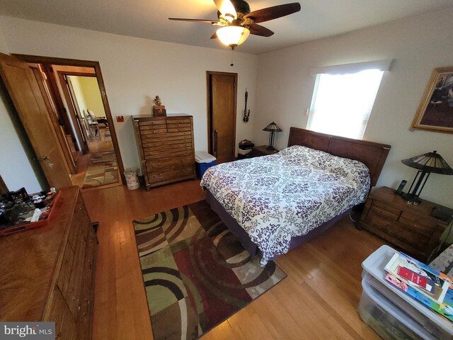 bedroom with wood finished floors and ceiling fan