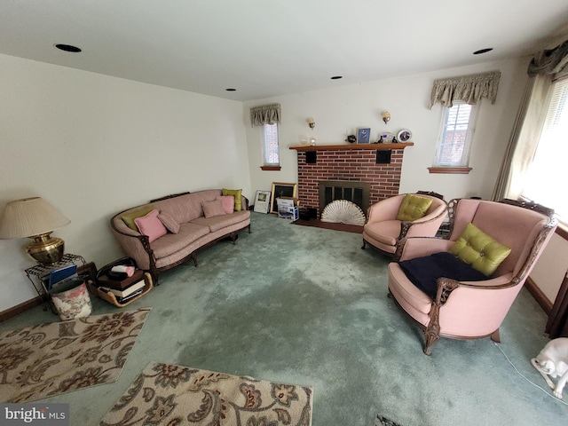 carpeted living area with a fireplace