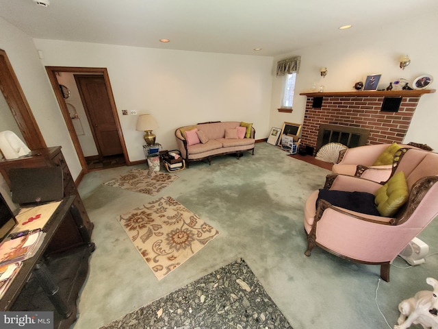 carpeted living area featuring a fireplace, recessed lighting, and baseboards