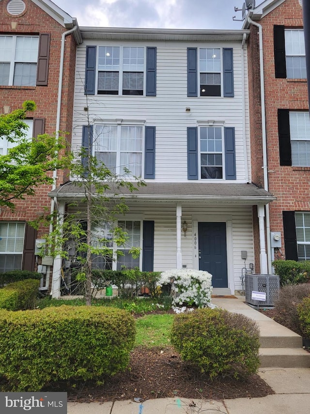 4006 Enders Ln, Bowie, MD 20716 - townhome / multi-family property with central AC unit and a porch