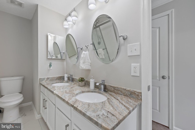 4006 Enders Ln, Bowie, MD 20716 - full bathroom with double vanity, toilet, and baseboards