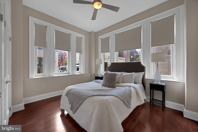 1830 Rittenhouse Sq Unit 1E, Philadelphia, PA 19103 - bedroom with multiple windows, dark wood-type flooring, and baseboards