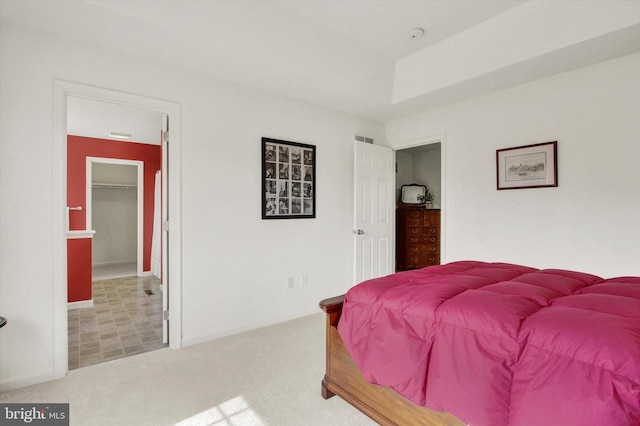 bedroom with visible vents and carpet flooring