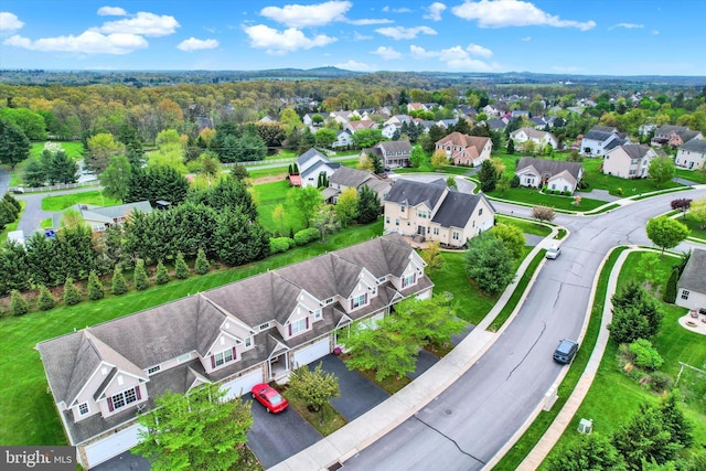 birds eye view of property with a residential view