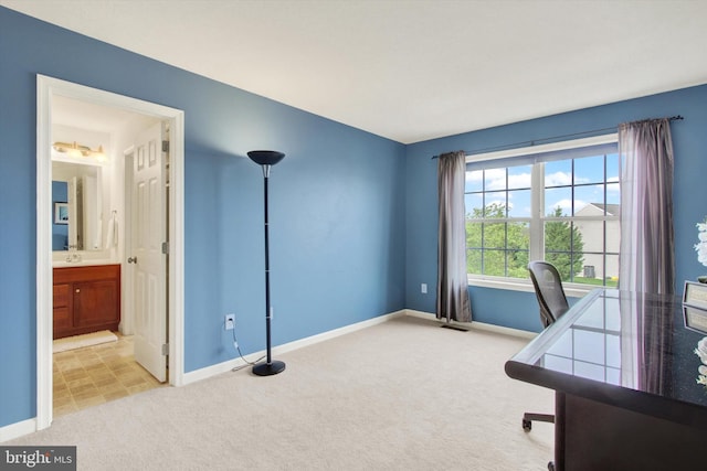 unfurnished office featuring carpet floors, baseboards, and visible vents