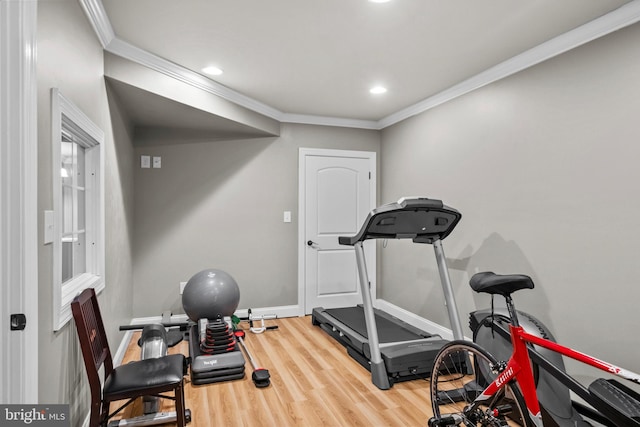 workout room with crown molding, recessed lighting, baseboards, and wood finished floors