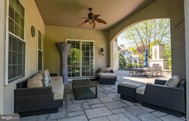 view of patio with a ceiling fan and an outdoor living space