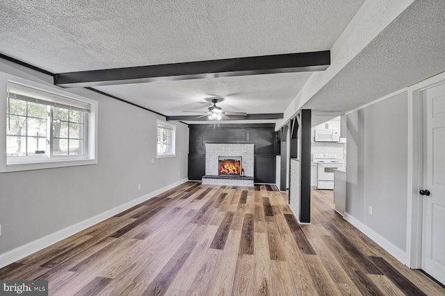 1640 Kreitler Valley Rd, Forest Hill, MD 21050 - unfurnished living room with ceiling fan, beam ceiling, a textured ceiling, and wood finished floors