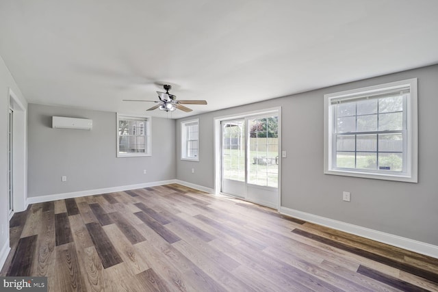 1640 Kreitler Valley Rd, Forest Hill, MD 21050 - empty room featuring baseboards, a ceiling fan, a wall unit AC, and wood finished floors