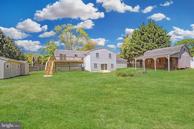 1640 Kreitler Valley Rd, Forest Hill, MD 21050 - rear view of property featuring a deck, an outbuilding, stairway, a storage unit, and a yard