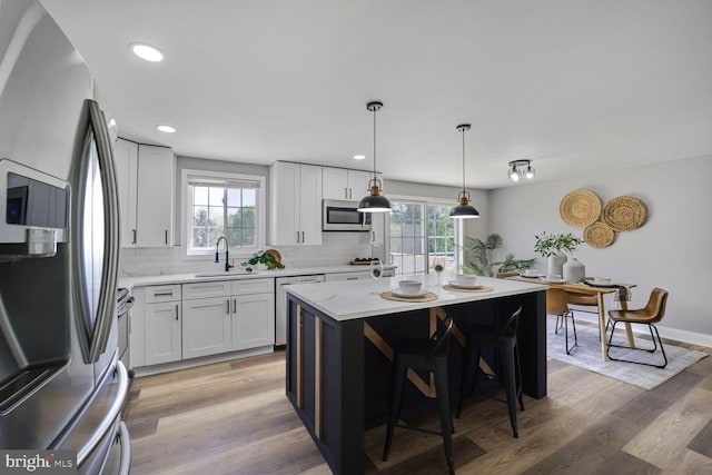 1640 Kreitler Valley Rd, Forest Hill, MD 21050 - kitchen with appliances with stainless steel finishes, backsplash, and a wealth of natural light