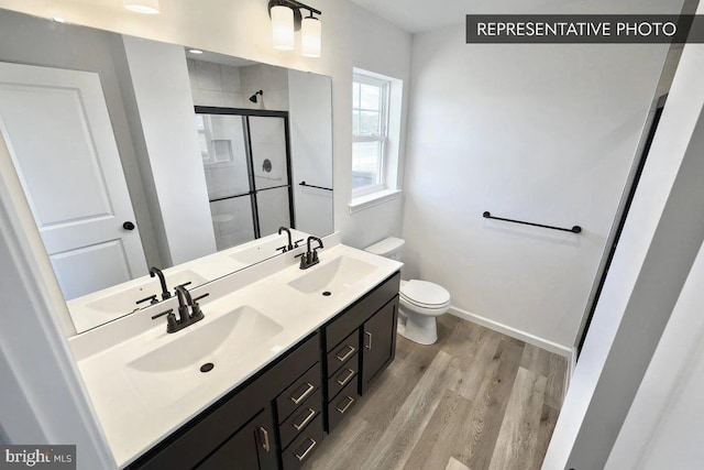 391 Santa Anita Dr Lot 112, Dillsburg, PA 17019 - full bathroom featuring toilet, wood finished floors, a sink, and a stall shower