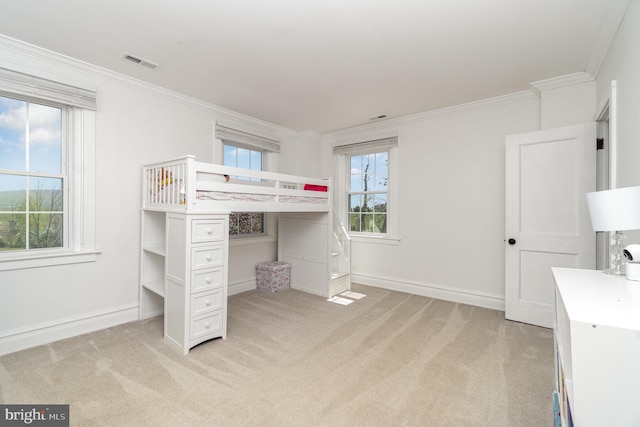 403 E Fourth St, Waynesboro, PA 17268 - unfurnished bedroom with visible vents, ornamental molding, baseboards, and light carpet