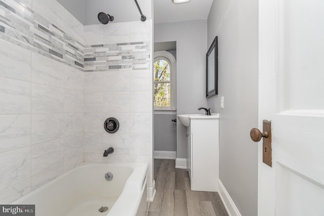 403 E Fourth St, Waynesboro, PA 17268 - full bath featuring shower / bathtub combination, baseboards, vanity, and wood finished floors