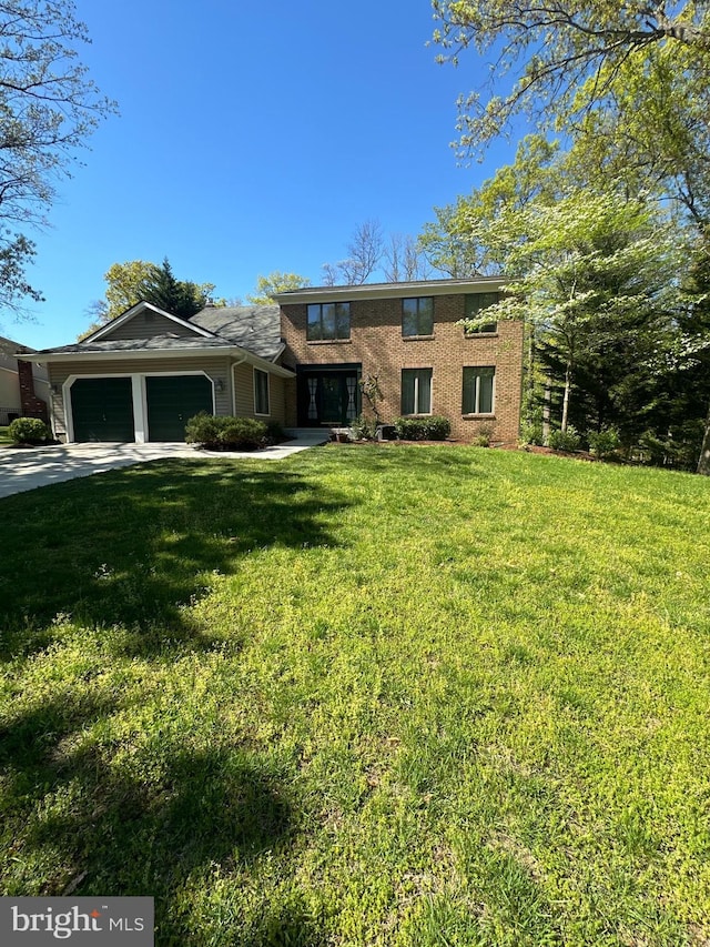 traditional-style house featuring a front lawn, brick siding, and an attached garage
