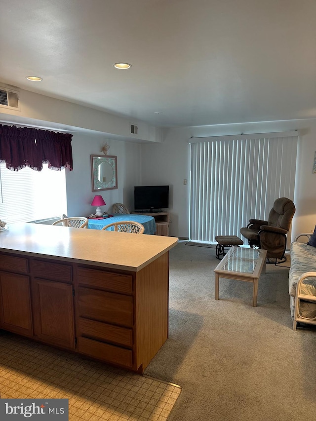 12304 Jamaica Ave Unit 206, Ocean City, MD 21842 - kitchen with light countertops, open floor plan, visible vents, and light carpet
