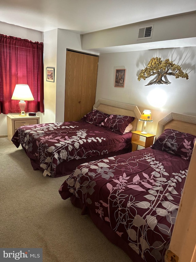 12304 Jamaica Ave Unit 206, Ocean City, MD 21842 - bedroom with visible vents, carpet flooring, and a closet