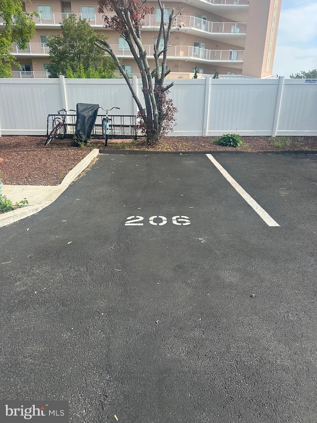 12304 Jamaica Ave Unit 206, Ocean City, MD 21842 - uncovered parking lot with fence