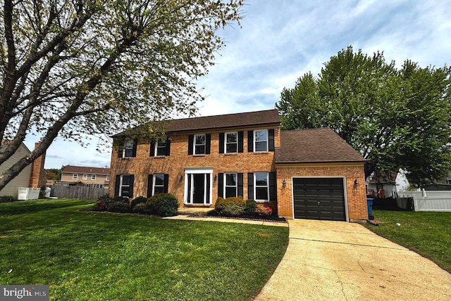 13 Sumac Ct, Newark, DE 19702 - colonial house with a garage, fence, driveway, and a front yard