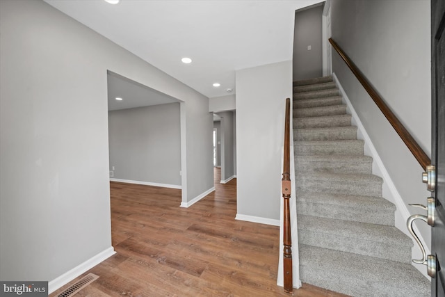 13 Sumac Ct, Newark, DE 19702 - stairway featuring baseboards, recessed lighting, wood finished floors, and visible vents