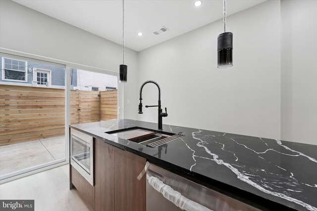 2230 Kimball St, Philadelphia, PA 19146 - kitchen with a sink, appliances with stainless steel finishes, modern cabinets, decorative light fixtures, and recessed lighting