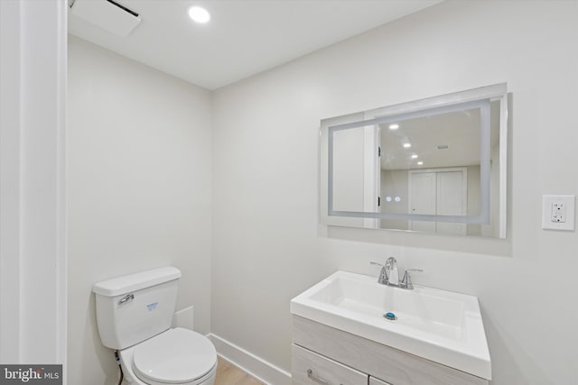 2230 Kimball St, Philadelphia, PA 19146 - bathroom with toilet, vanity, baseboards, wood finished floors, and recessed lighting
