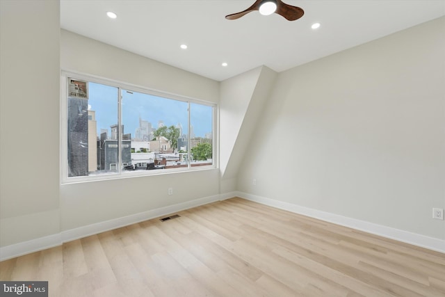 2230 Kimball St, Philadelphia, PA 19146 - spare room featuring wood finished floors, ceiling fan, recessed lighting, baseboards, and a view of city