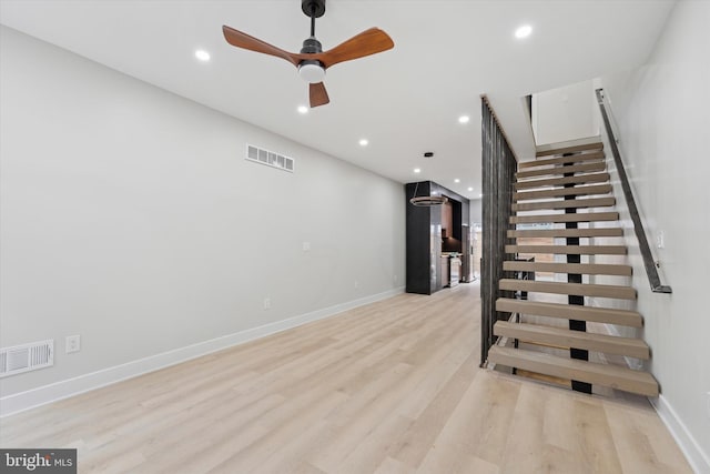 2230 Kimball St, Philadelphia, PA 19146 - stairs featuring wood finished floors, baseboards, a ceiling fan, and recessed lighting