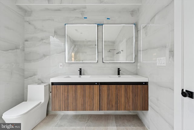 2230 Kimball St, Philadelphia, PA 19146 - full bathroom with tile walls, double vanity, and toilet