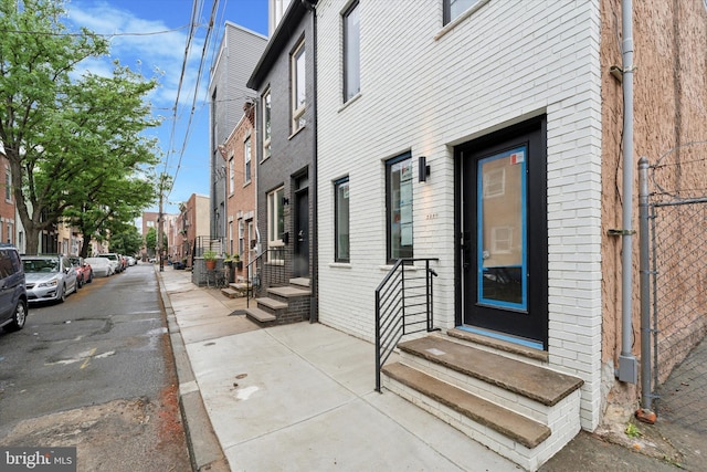 2230 Kimball St, Philadelphia, PA 19146 - doorway to property with brick siding and a residential view