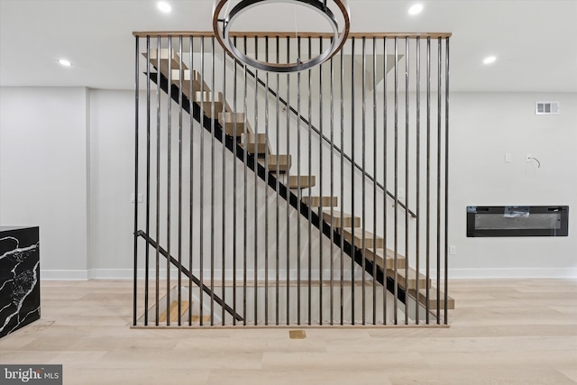 2230 Kimball St, Philadelphia, PA 19146 - staircase with recessed lighting, baseboards, and wood finished floors
