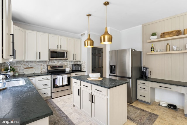 kitchen featuring a kitchen island, backsplash, visible vents, ornamental molding, and stainless steel appliances