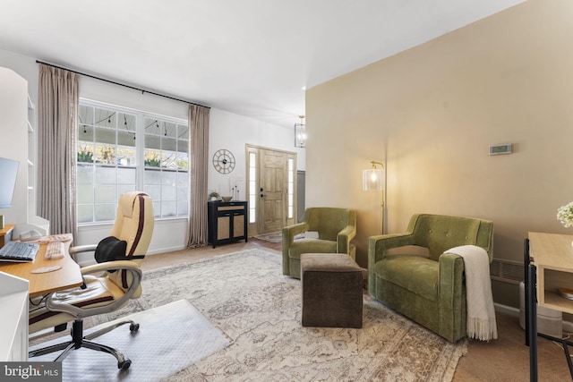 office with baseboards and carpet