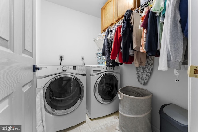 laundry area featuring cabinet space and independent washer and dryer