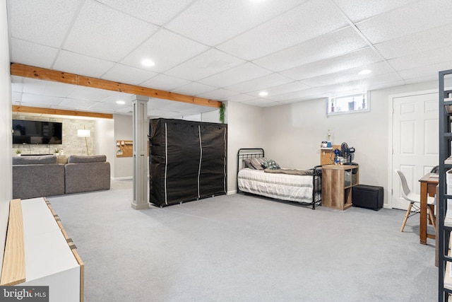 carpeted living room featuring recessed lighting and a paneled ceiling