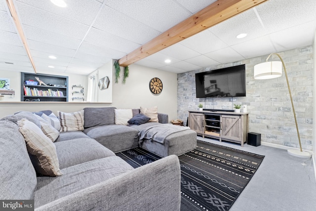 carpeted living room with a drop ceiling and recessed lighting