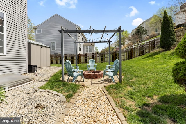 view of yard with a patio, a fire pit, and a fenced backyard