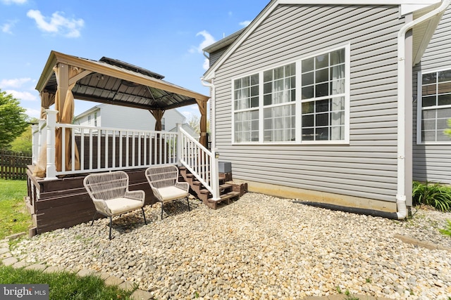 exterior space with fence and a gazebo