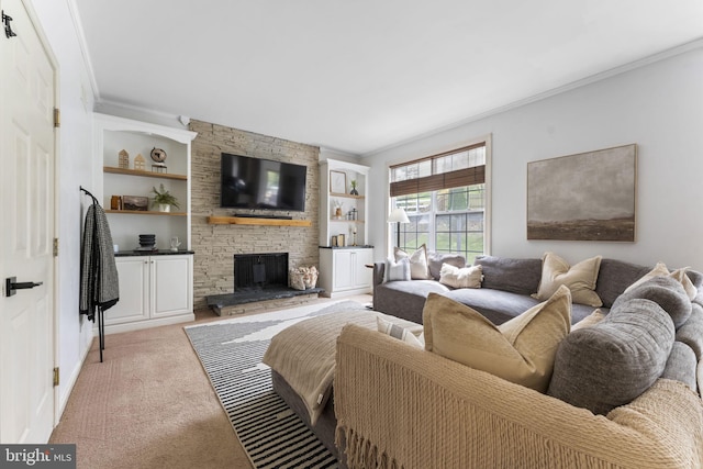 living area featuring ornamental molding, a fireplace, built in shelves, and light carpet