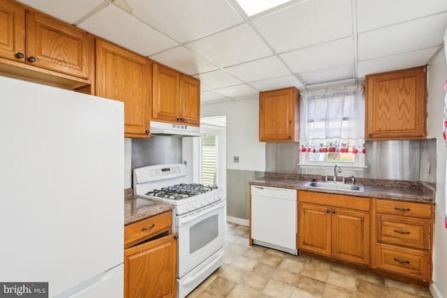8 Sullivan Ave, Bellmawr, NJ 08031 - kitchen featuring white appliances, a sink, under cabinet range hood, a drop ceiling, and brown cabinets