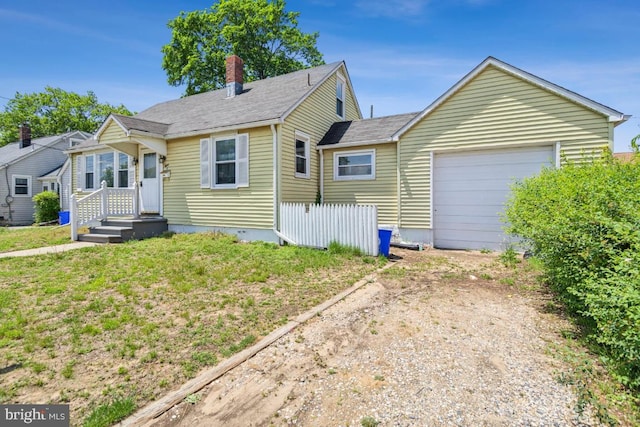 8 Sullivan Ave, Bellmawr, NJ 08031 - view of front of property with driveway, a garage, and a chimney