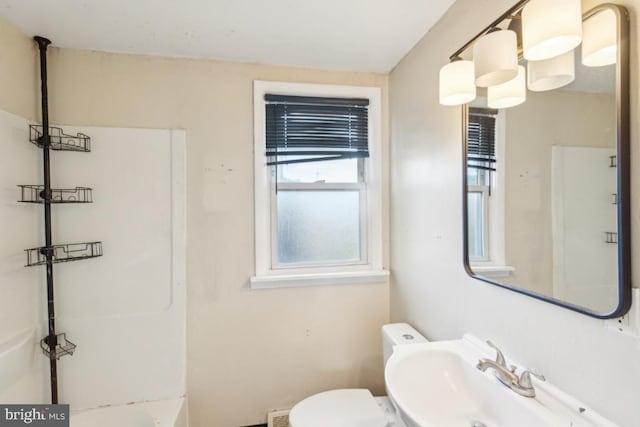 8 Sullivan Ave, Bellmawr, NJ 08031 - bathroom featuring a sink, plenty of natural light, toilet, and a tub to relax in