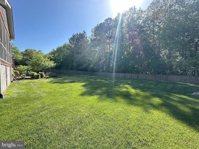 view of yard with a fenced backyard