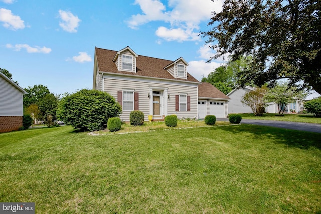 cape cod house with a garage, a shingled roof, a front yard, and aphalt driveway