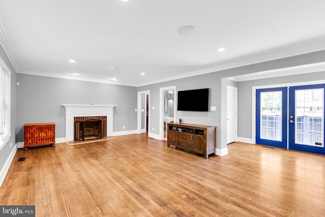 unfurnished living room featuring baseboards, a fireplace, and visible vents
