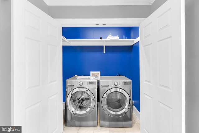 washroom featuring independent washer and dryer, laundry area, crown molding, and tile patterned flooring